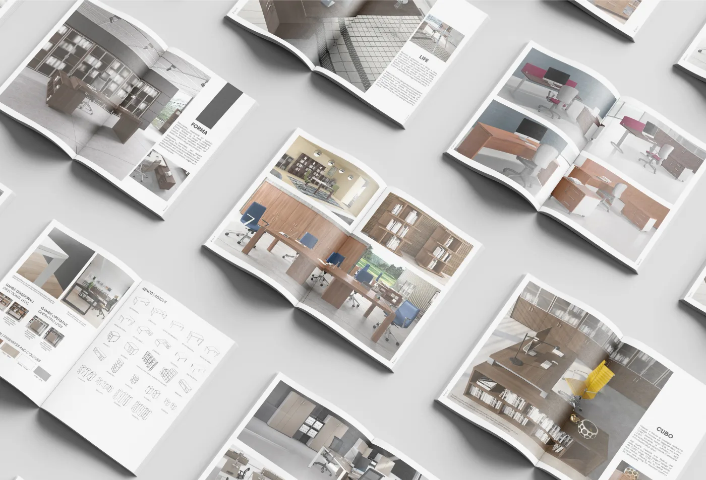 Catalogo Flycom per l'arredo ufficio: pagine aperte con scrivanie, librerie e sedute